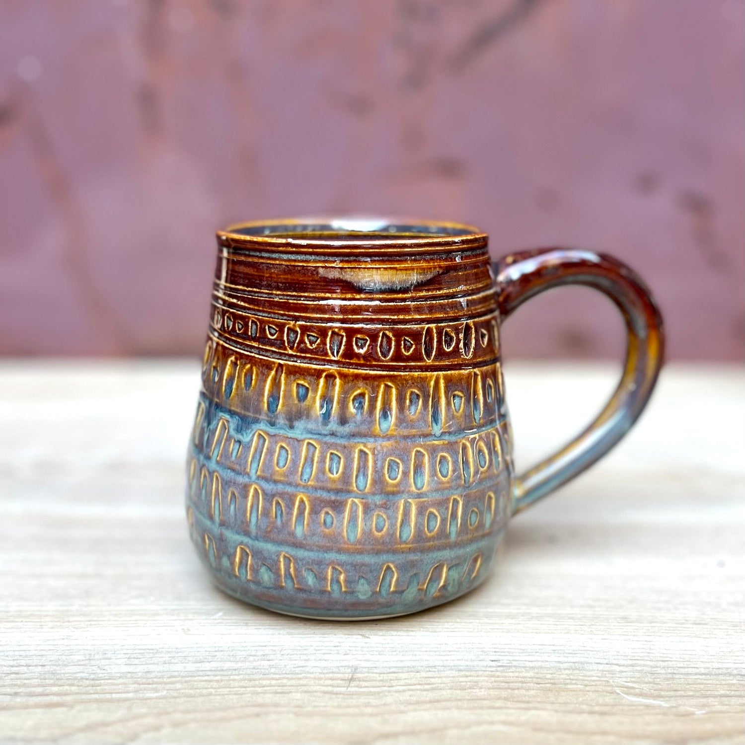 Colorful carved pottery cup