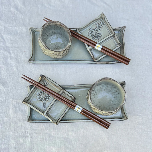 6 piece black ceramic sushi set with cups and botanical stamp