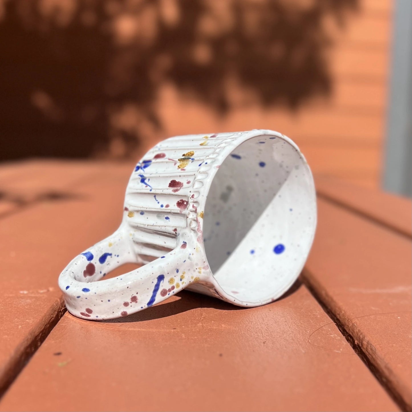 Hand carved 16 oz white ceramic paint splatter mug