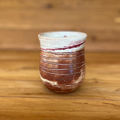 small stemless round pottery tumbler
