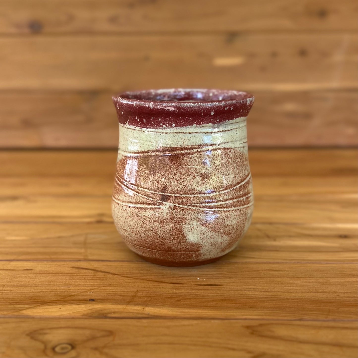 small stemless red clay ceramic bell-shaped wine tumbler