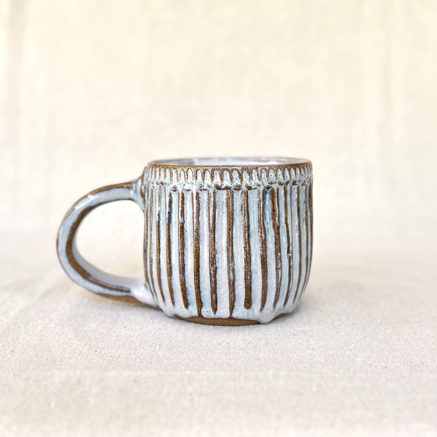Large blue ceramic carved coffee mug with handle