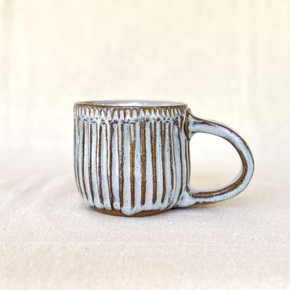 Large blue ceramic carved coffee mug with handle